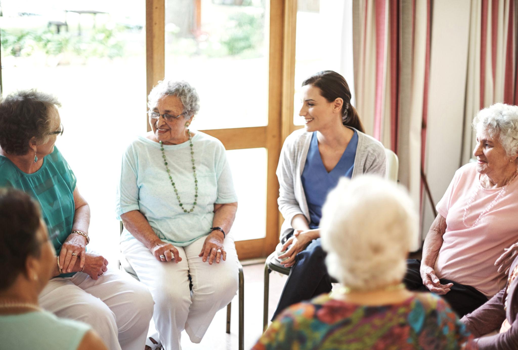 Residents chatting with caregiver
